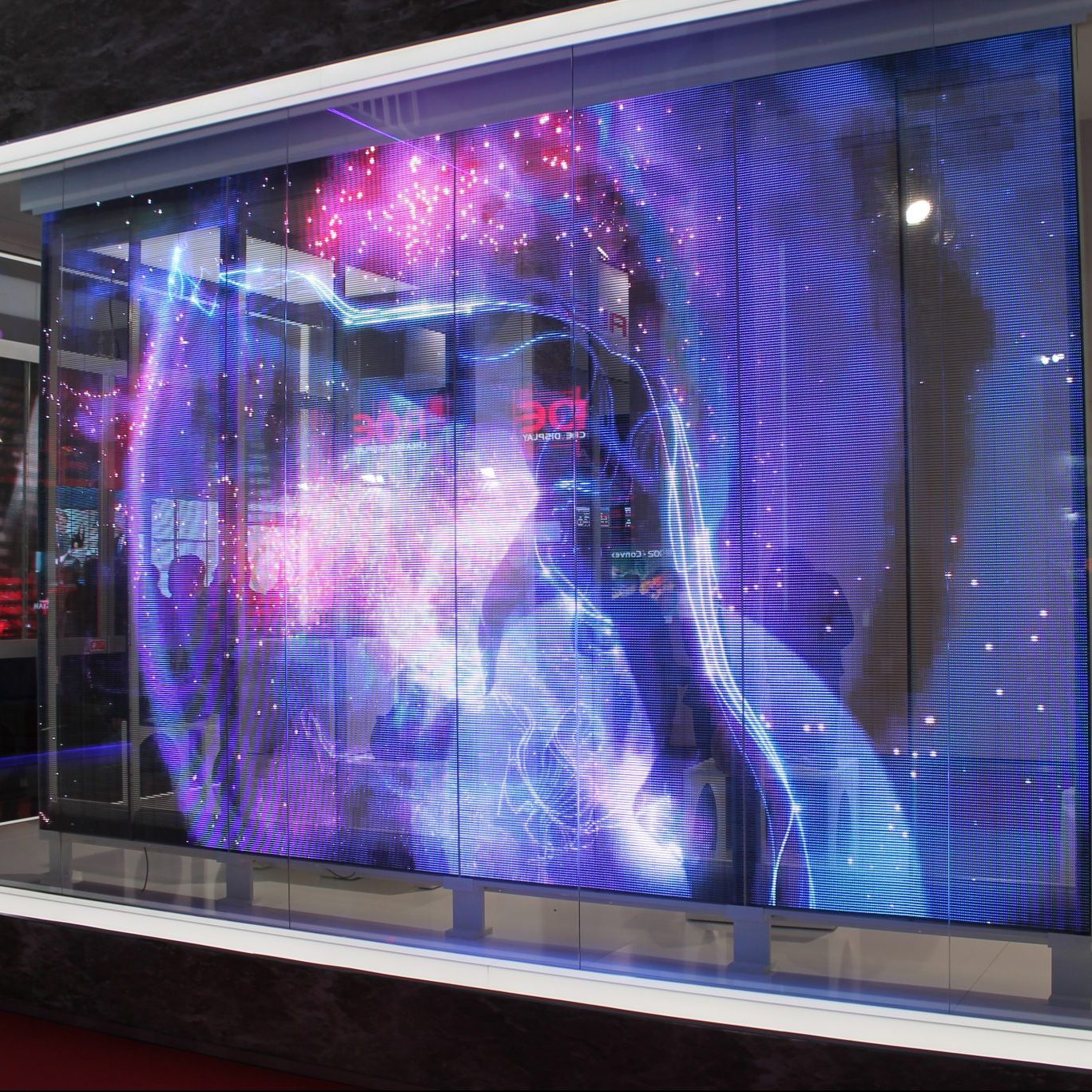 Image shows a digital screen inside a shop window