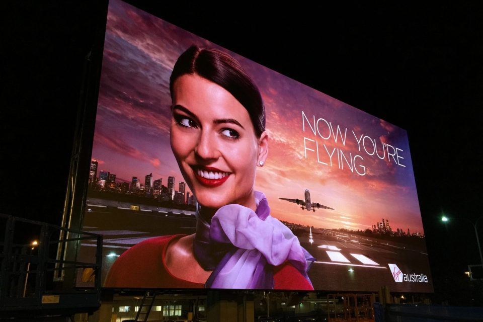 Image shows a digital screen outside an airport