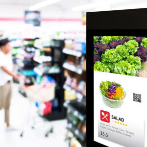 Image shows a free standing digital display at a supermarket